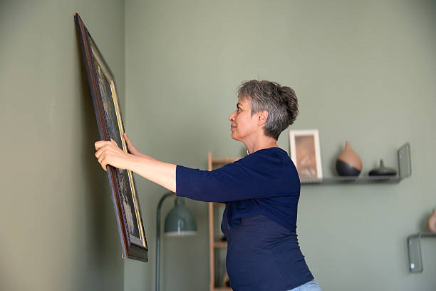 istock Woman decorating home 2230315402