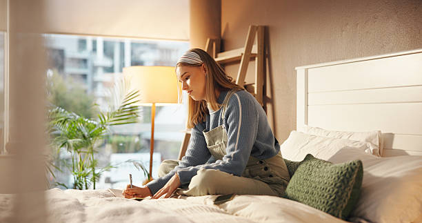 istock Writing, notebook and reminder with student in bedroom for study, assignment due date and course. University planning, gpa progress and academic calendar with woman in home for college grades 2230317438