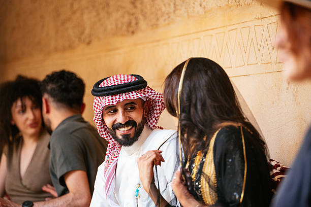 istock Diverse Middle Eastern people enjoying tea time and smiling 2230319198