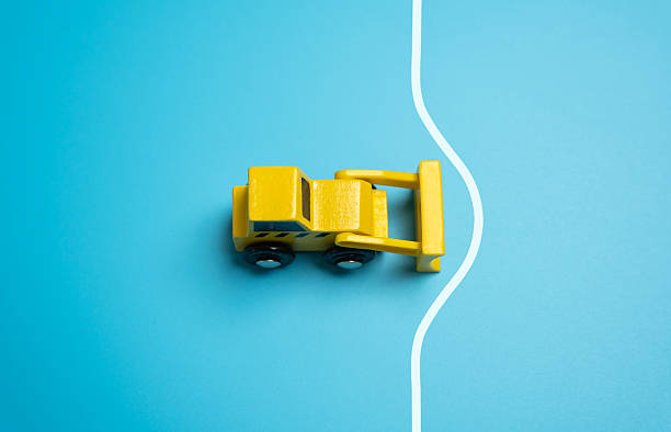istock The bulldozer pulls back the border and expands the space. Expansion of limits and what is permitted. Increasing the territory of development area and construction. 2230319491