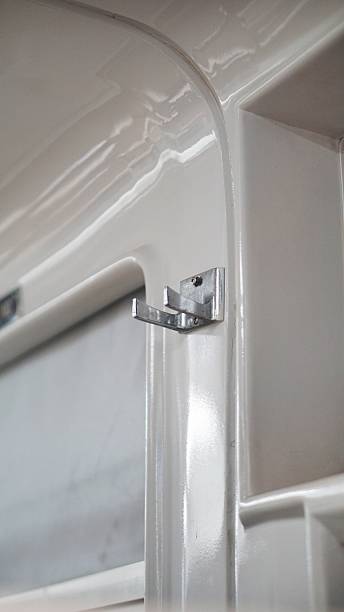 istock Minimalistic metal wall hook in clean white interior of a railway cabin 2230320365