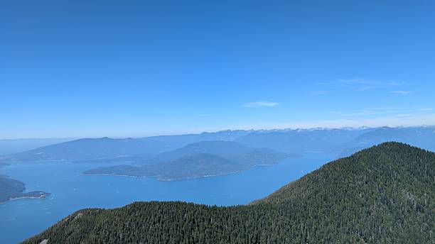 istock Vast blue sky over scenic pacific northwest mountain and inlet landscape (Howe Sound on British Columbia's coast) 2230323097