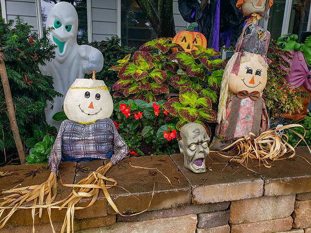 istock Halloween Yard Decorations with Scarecrows and Ghosts. Festive outdoor setup with spooky props and autumn colors. 2230327577
