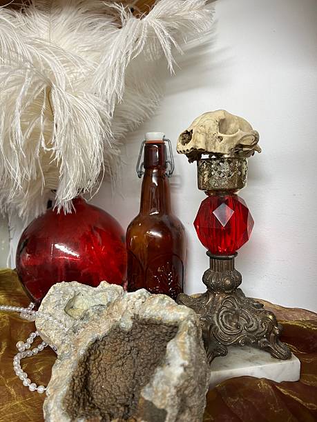 Creepy wall display with red bottles and an animal skull