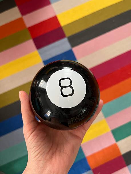 istock Magic 8 ball over colorful rug 2230333206