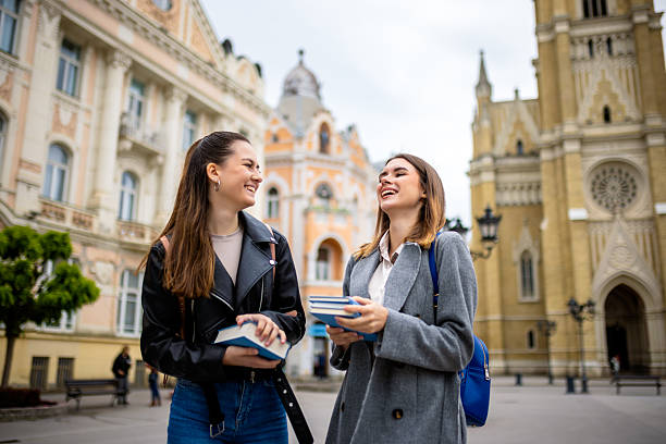 istock Two Female Students with Books on College Campus 2230333219