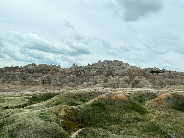 istock Green hills with mountains in the background 2230333721