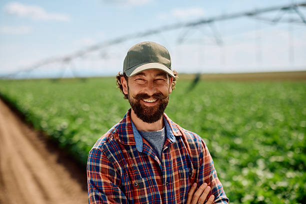 istock Confident farm owner in the field looking at camera. 2230335940