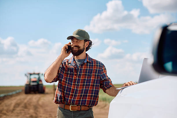 istock Happy agronomist making a phone call in the field. 2230335956