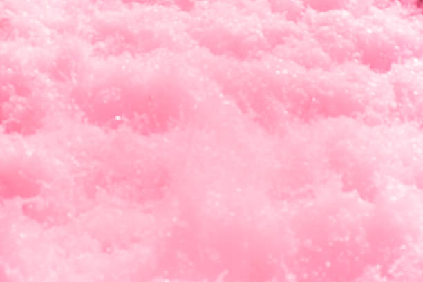 istock Pink water bubbles on the surface ripples. Defocus blurred transparent pink colored clear calm water surface texture with splash and bubbles. Water waves with shining pattern texture background 2230343230