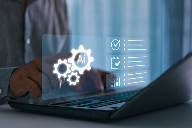 istock Businessman using AI technology on laptop for task automation, project planning and data analysis, symbolizing artificial intelligence, digital transformation and productivity in modern business. 2230343391