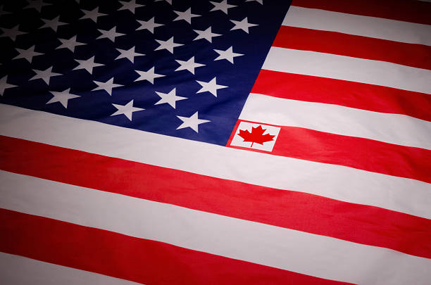 A red maple leaf - the main center symbol on Canada's flag, is attached to USA's Stars & Stripes flag, suggesting that Canada should become the 51st state.