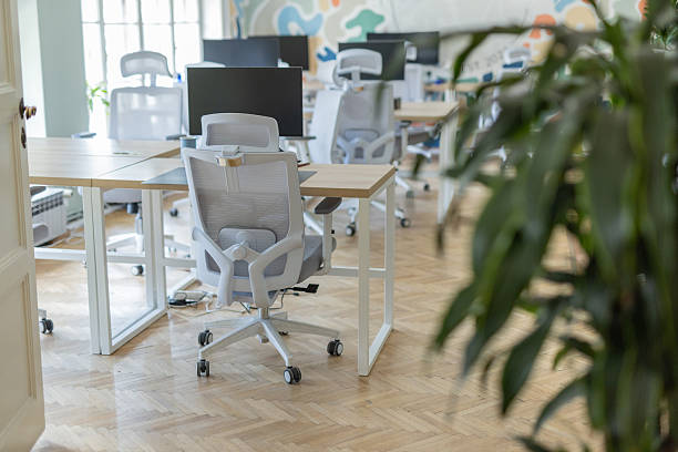 istock Bright office area showcasing empty workspaces and furniture 2230347266