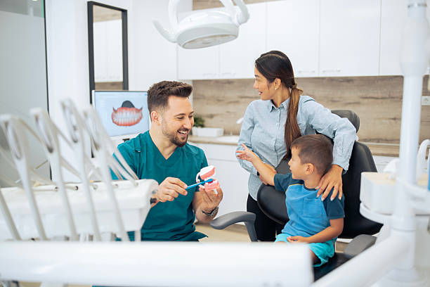 istock Asian family having a dental checkup from early age. 2230347849