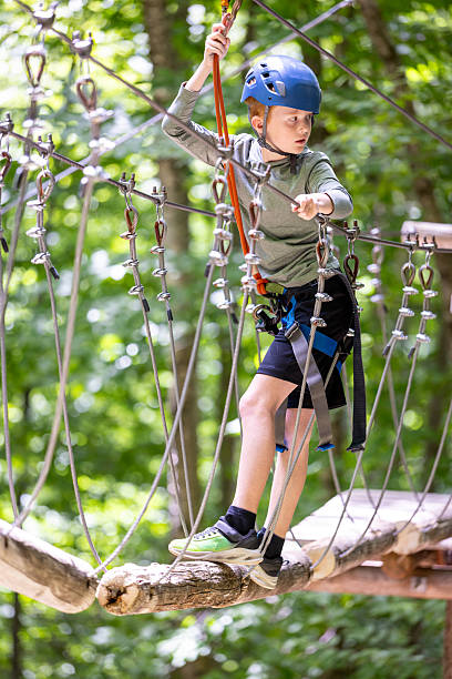 istock Young Boy having fun in Rope park during summer 2230351770