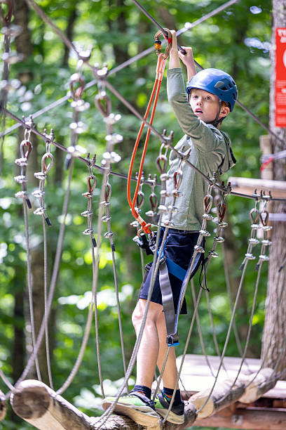 istock Young Boy having fun in Rope park during summer 2230351826