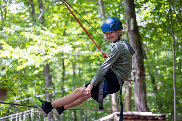 istock Young Boy having fun in Rope park during summer 2230351944