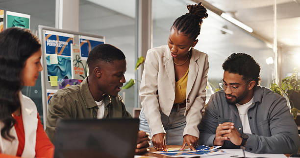 istock Creative people, meeting and documents in office for graphic design, planning and research. Digital agency, communication and worker with tech, social media or idea for website or ui project homepage 2230354298