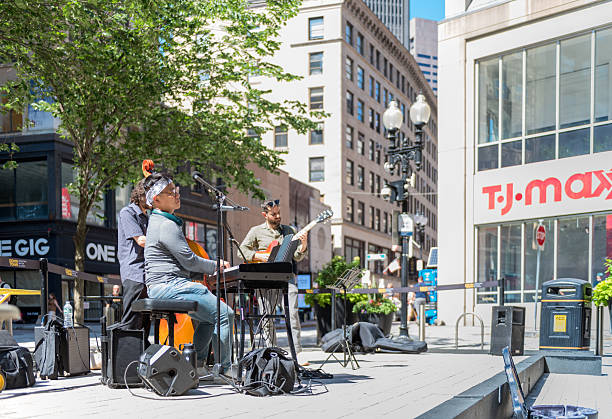 Boston, Massachusetts - USA, July 23, 2025. Street musicians entertain passersby and the public with jazz music in Boston's Downtown Crossing neighborhood.
