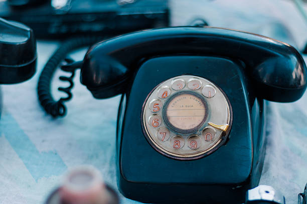 Antique wired transmitter or telephone used to call or communicate with other people, antique, communication, retro vintage