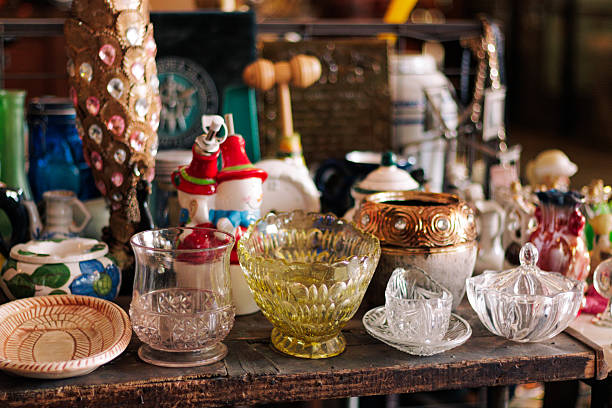 Colorful kitchen and shelf displaying antique-style dishes, plates, glasses, cups, etc