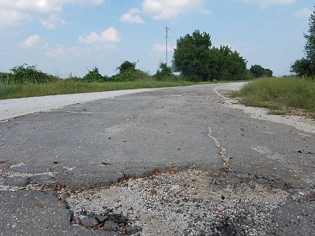 istock Big Deep Pothole on Route 66 where it is One Lane Near Miami, Oklahoma 2230363497