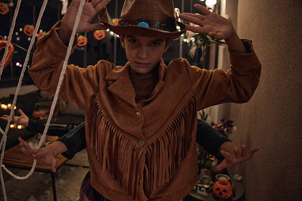 Beautiful boy on Halloween night dressed up in costume.