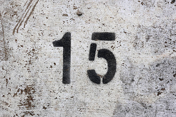 istock The number 15 stencilled in black on a weathered concrete surface 2230374370
