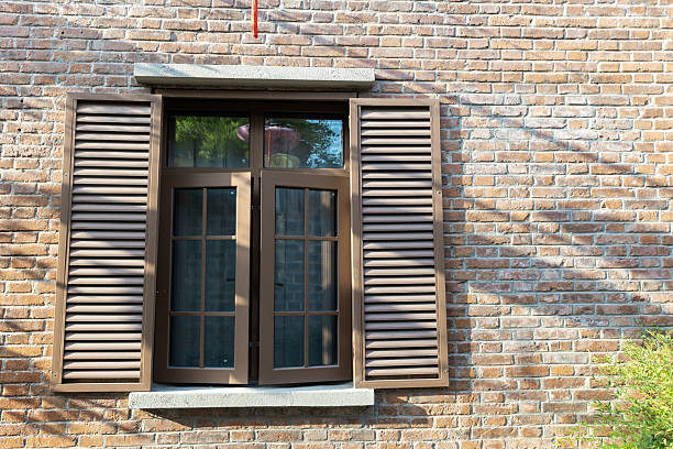 istock Brick wall and wooden shutters 2230378255