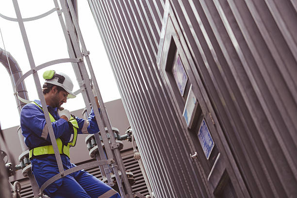 istock Engineer under checking the industry cooling tower air conditioner is water cooling tower air chiller HVAC of large industrial building to control air system 2230379031