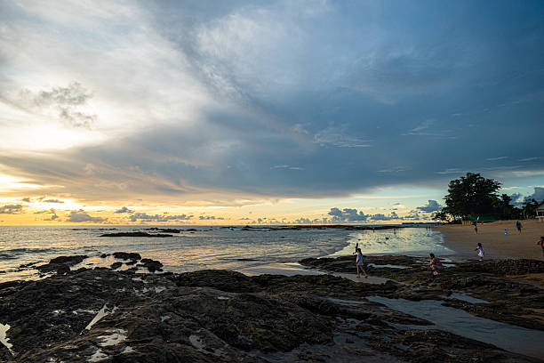 istock Silhouette sunset light on se beach wave people travel enjoying sunset 2230381671