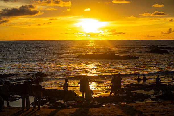 istock Silhouette sunset light on se beach wave people travel enjoying sunset 2230382101