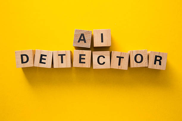 istock Ai detector written with wooden cubes on yellow background 2230382357