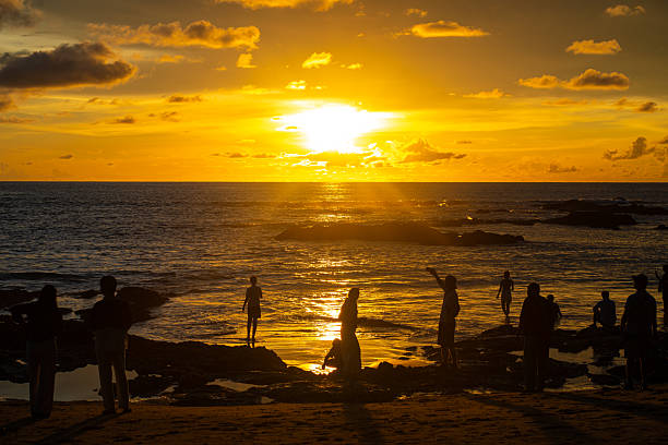 istock Silhouette sunset light on se beach wave people travel enjoying sunset 2230382719