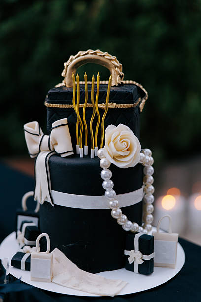 istock Glamorous Multi-Tiered Chocolate Celebration Cake with Cream Decorations. 2230382913