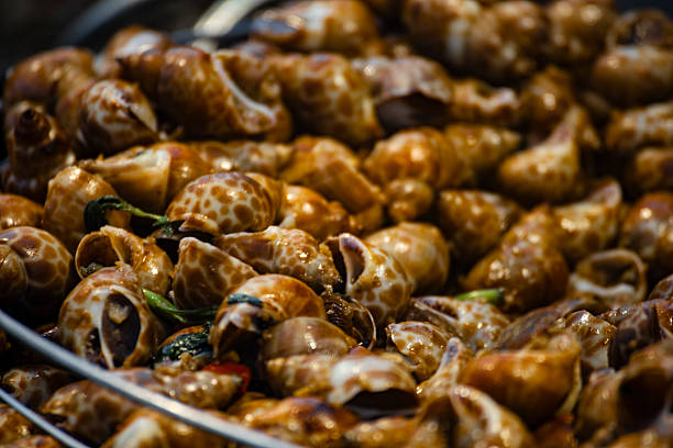 a classic Taiwanese night market delicacystir-fried snails