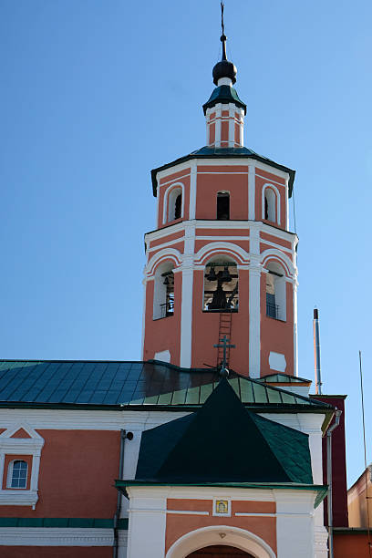 istock Bell tower stands tall against a clear blue sky, showcasing intricate architectural design and weathered charm in a historic location 2230394738