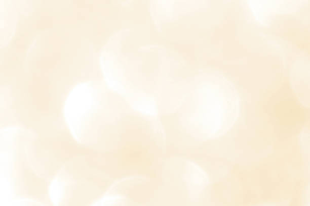 istock Cream beige golden and white bokeh texture background. 2230395982