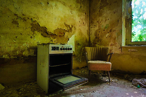 old fashioned stove and armchair in a lost Place