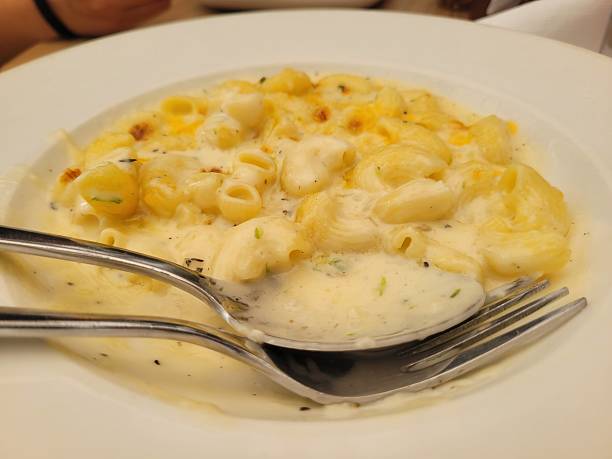 istock Baked macaroni and cheese with fresh tomato sauce 2230405992