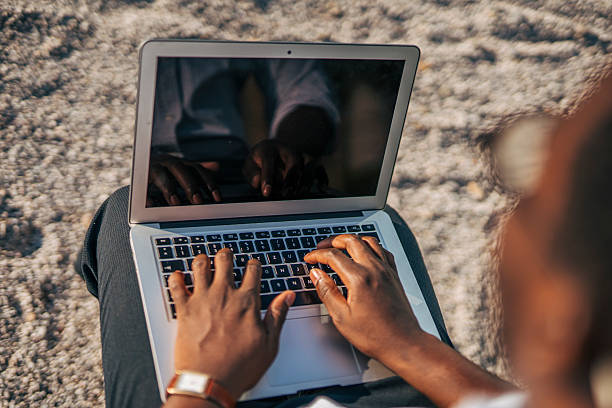 istock Freelancer working on laptop outdoors in casual clothing 2230408128