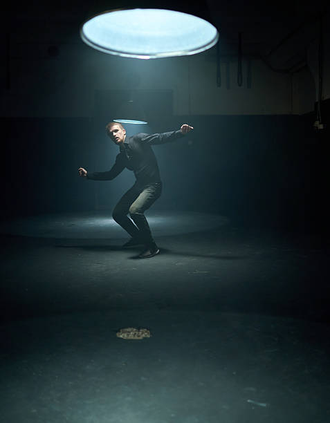 istock Slender young male dancer showing hip hop movement 2230408405