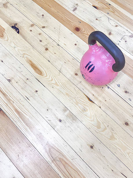 istock Pink Kettlebell on Wooden Floor 2230411604