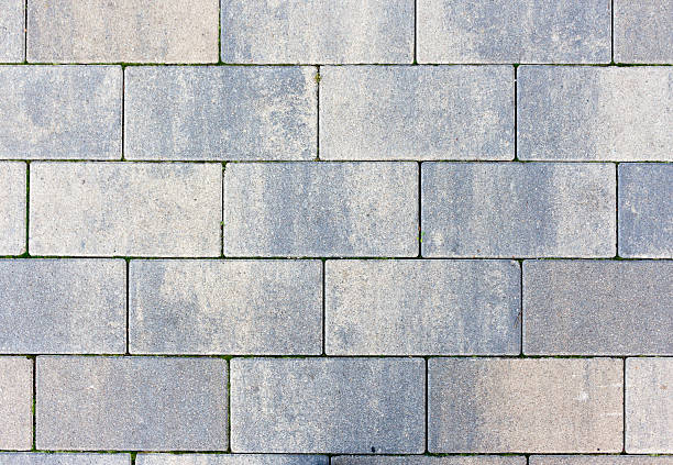 istock Grey brick wall background close up. Gray stone tile block background with horizontal texture of gray brick. Gray brick surface. 2230421970