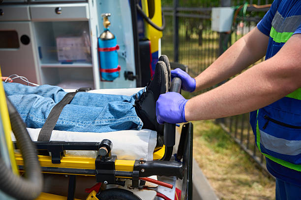istock Paramedic pushing stretcher with patient into ambulance 2230422974