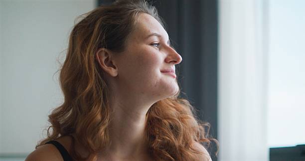 istock Woman Waking Up with Morning Sunlight 2230423120