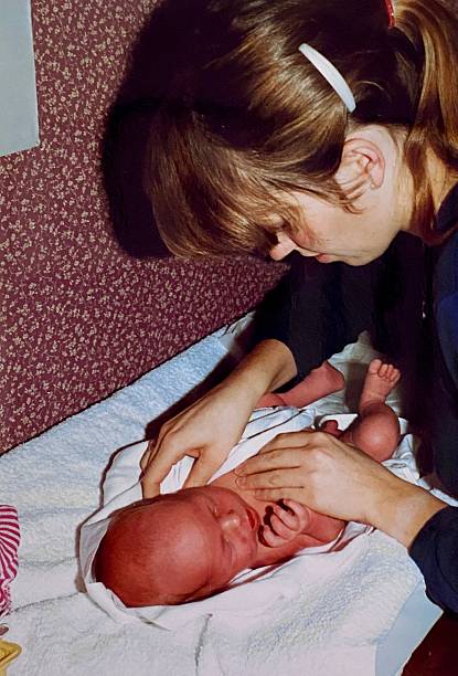 istock Young Mother with Baby, back in the Seventies. 2230423672