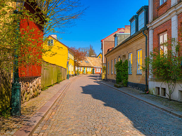 istock Charming cobblestone street in Adelgatan, Lund, Sweden 2230431502