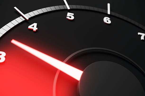 istock Close-up view of a modern speedometer with glowing red needle and black abstract background in a sleek technological design. 3D Rendering 2230432492