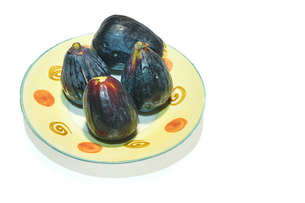 Fresh figs whole and halved, showing rich internal texture and seeds